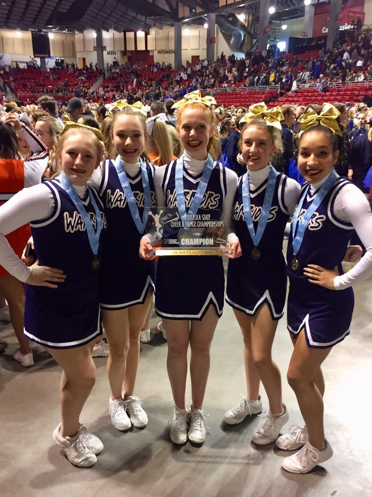 Cheerleaders with State Championship Trophy