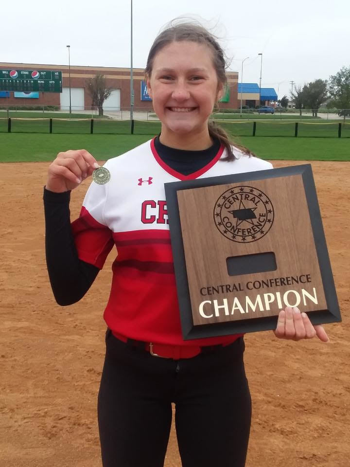 Softball player with championship trophy